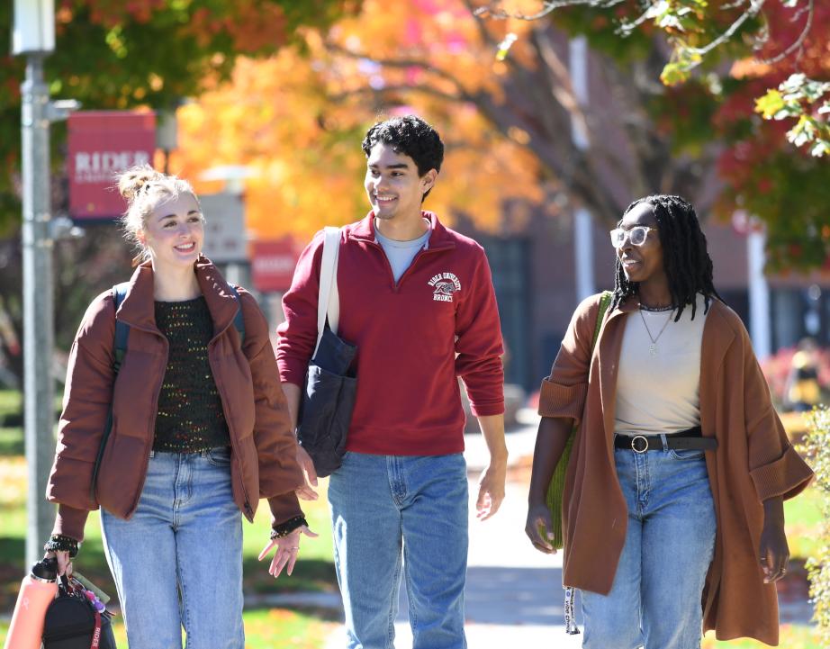 Students walking campus in the fall