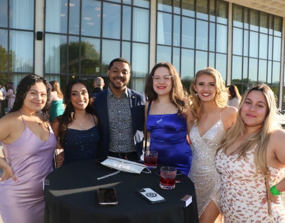 Group of alumni pose for photo