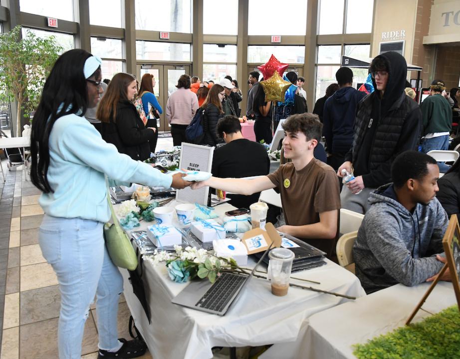 Students sell their products at the Business in Action Market Fair.