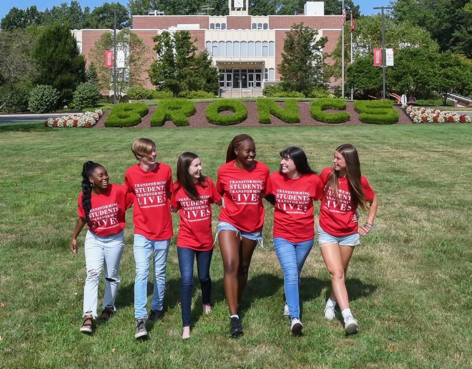 Students on campus mall in front of library 