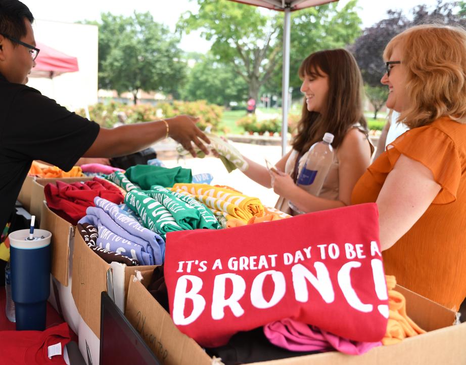 New student orientation handing out t-shirts