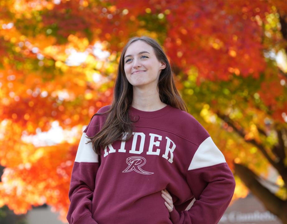 Rider student in gear outdoors in fall