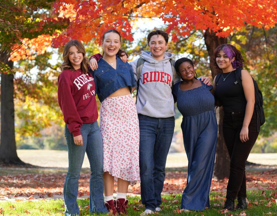 Smiling Rider students on campus in autumn