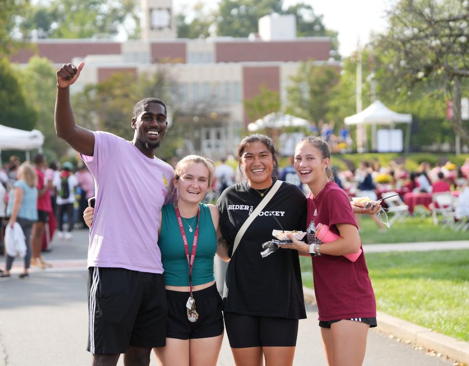 Students smile and wave while attending Cranberry Fest