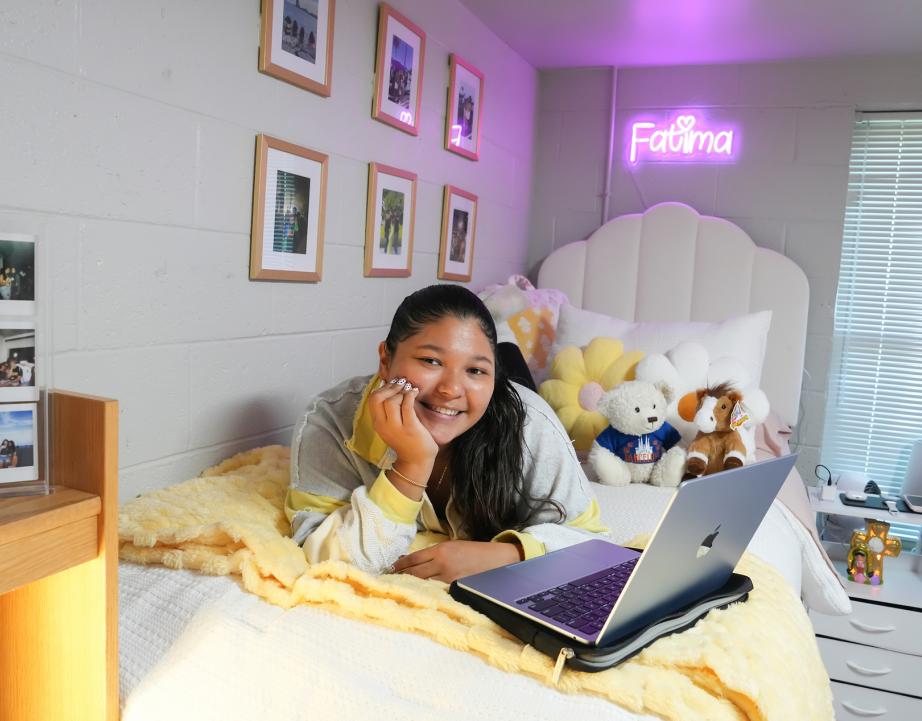 student in dorm room