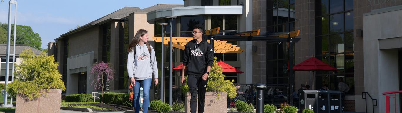 Two students walk near Student Recreation Center