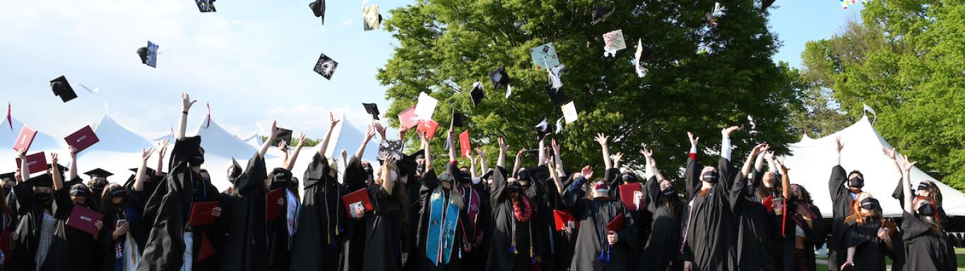 2021 graduates toss their caps