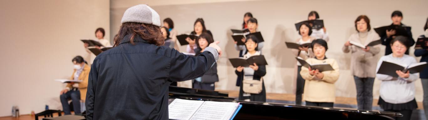 Conductor directs women's chorus