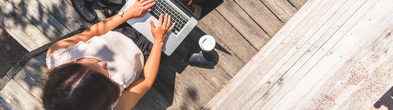 Woman on laptop outside