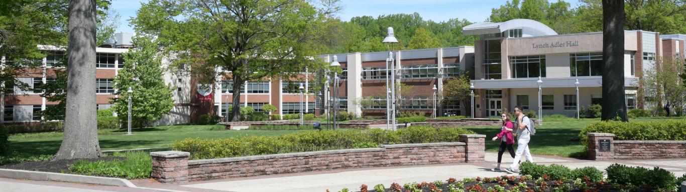 Students walk near Lynch Adler hall