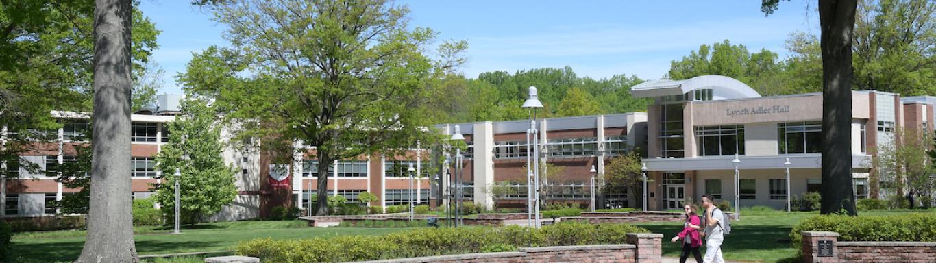 Students walk near Lynch Adler hall