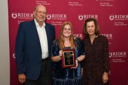 2022 winner Cait Hopkinson '26 with Norm Brodsky '64 and Elaine Brodsky