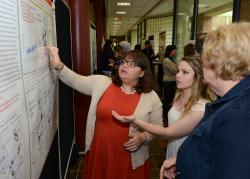 050416_ISCAP_012.jpg Students explain research at presentation.