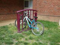 photo of a bicycle parked in a rack