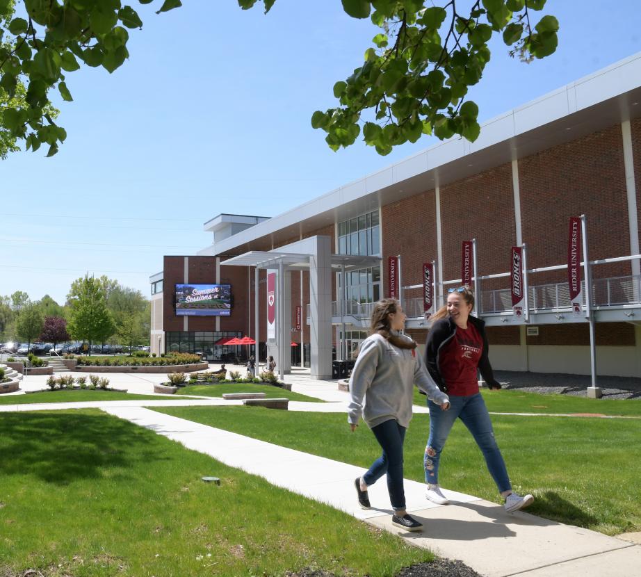 Students walk in front of Bart Luedeke Center