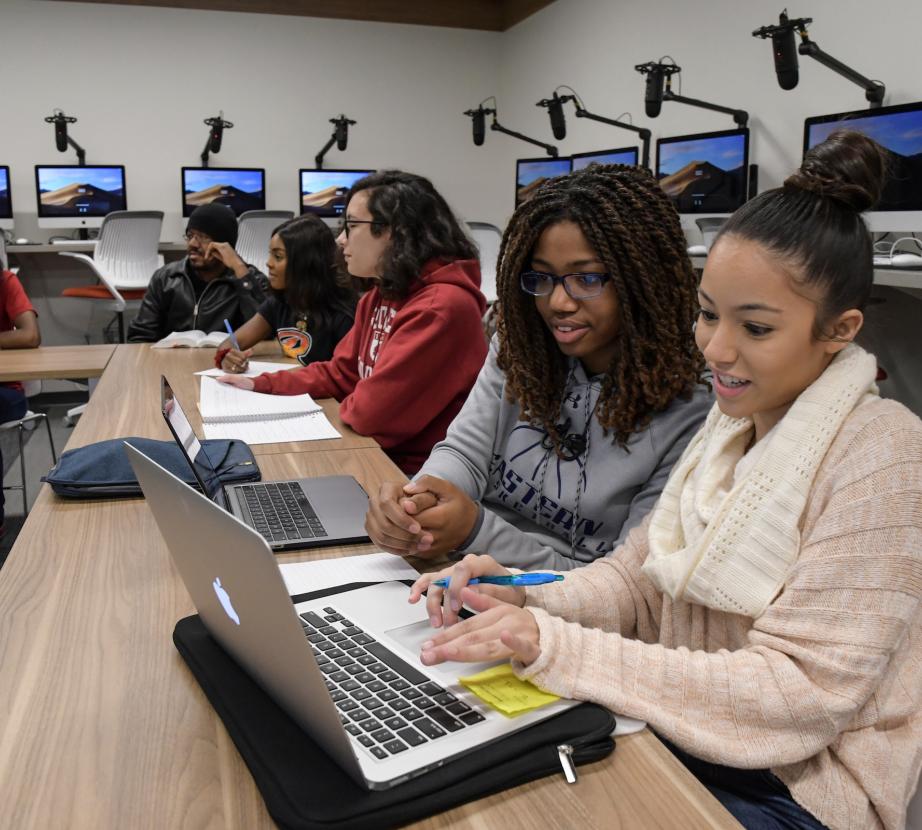 Two students collaborate on an academic project