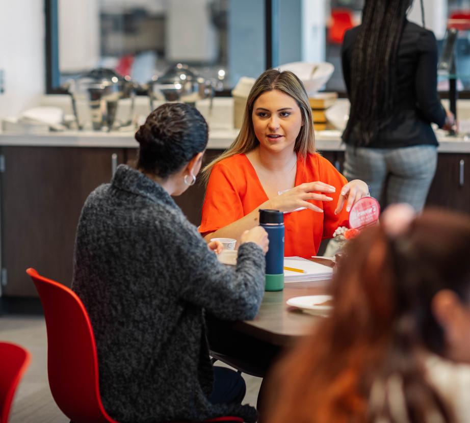 Students interact during women's leadership council event