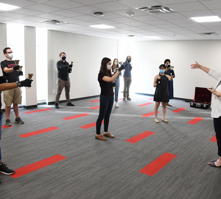 Members of the Westminster Concert Bell Choir and conductor Kathleen Ebling Shaw test the acoustics — socially distant — in the new Presser Handbell Room.
