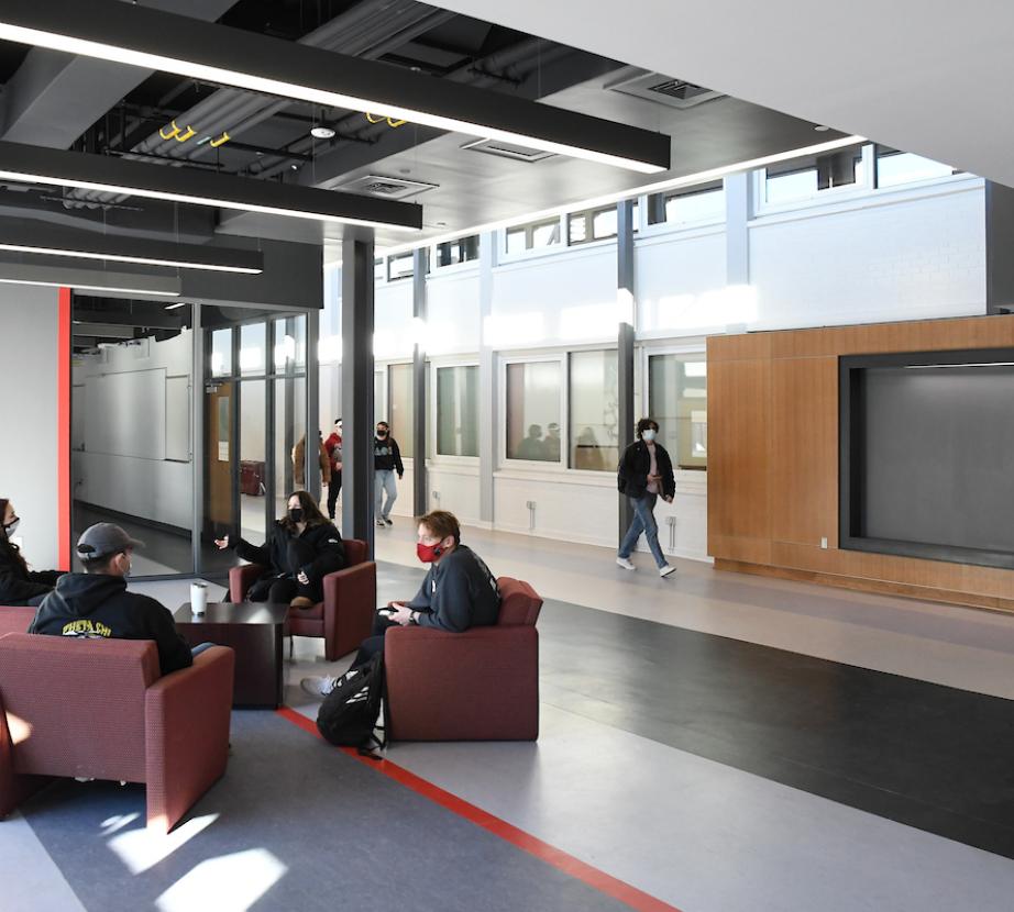 Students converse in the Science and Technology entryway