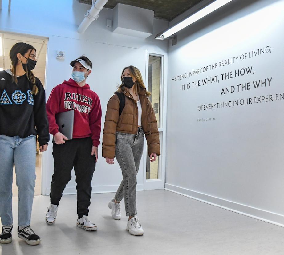 Students walk together in the Science and Technology Center entryway