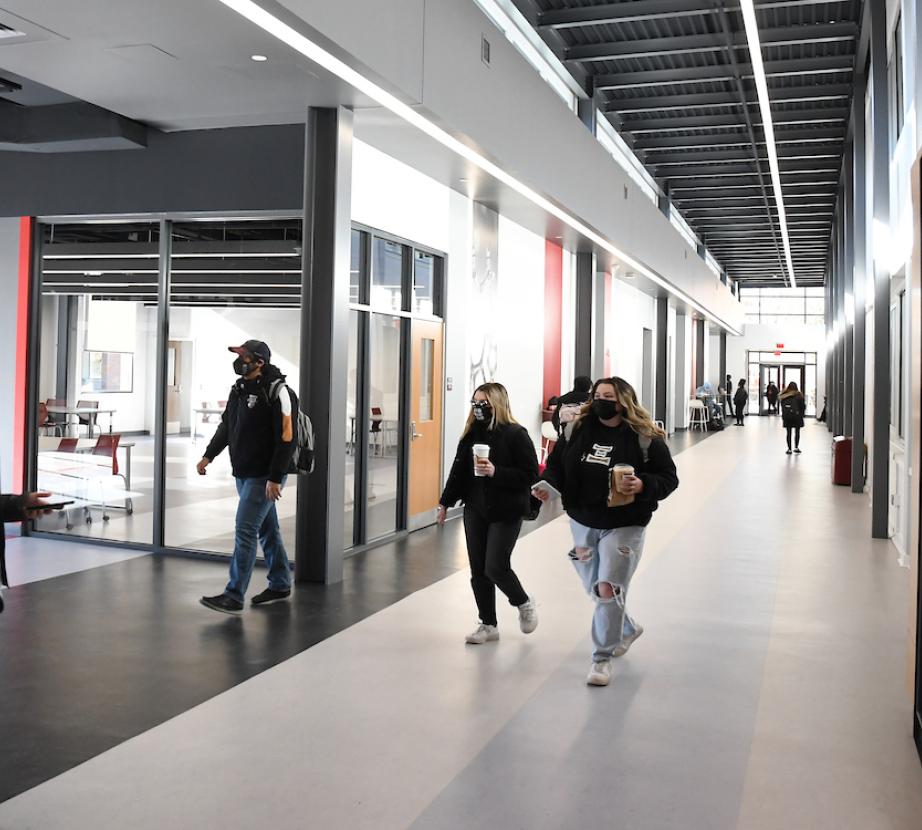Students converse in the Science and Technology Center entryway