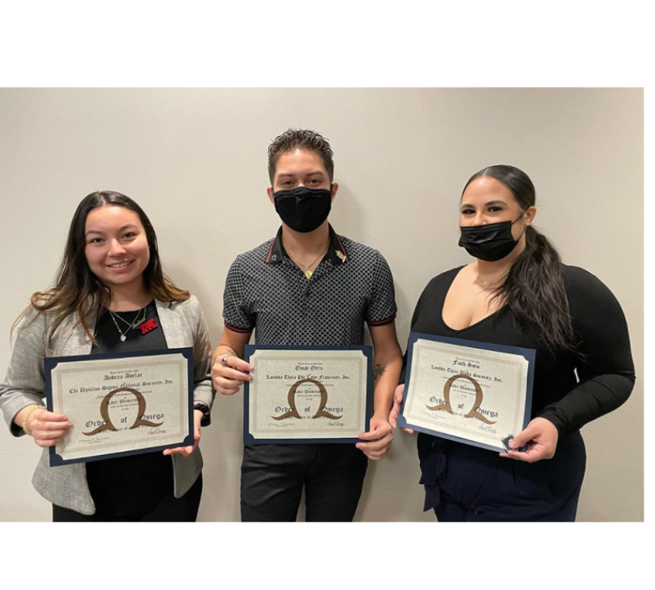 Multicultural Greek Council students hold up awards