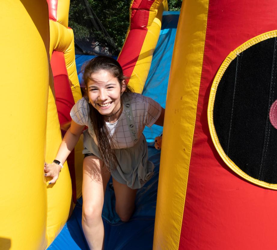Student climbs on inflatable at Cranchella