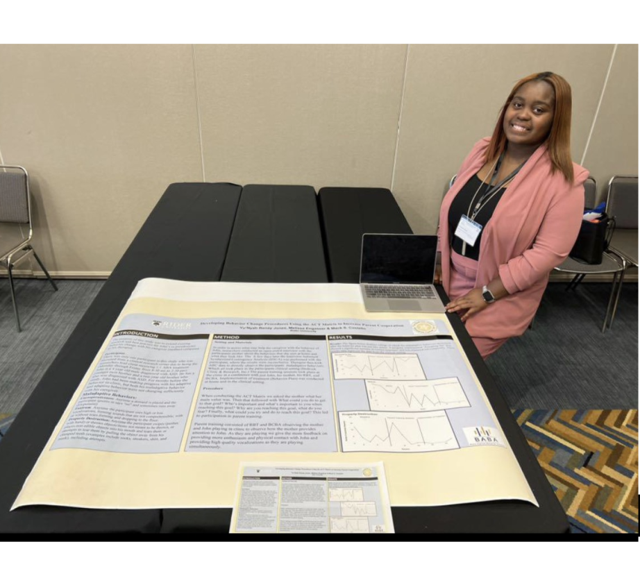 Yu'Njah Jones poses next to presentation