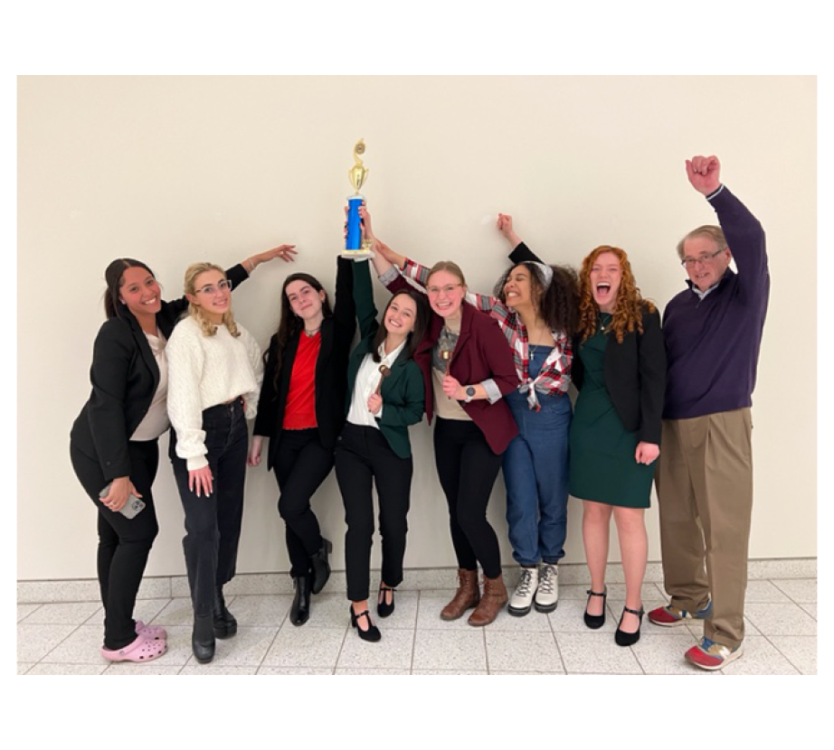 Mock Trial team members hold up trophy