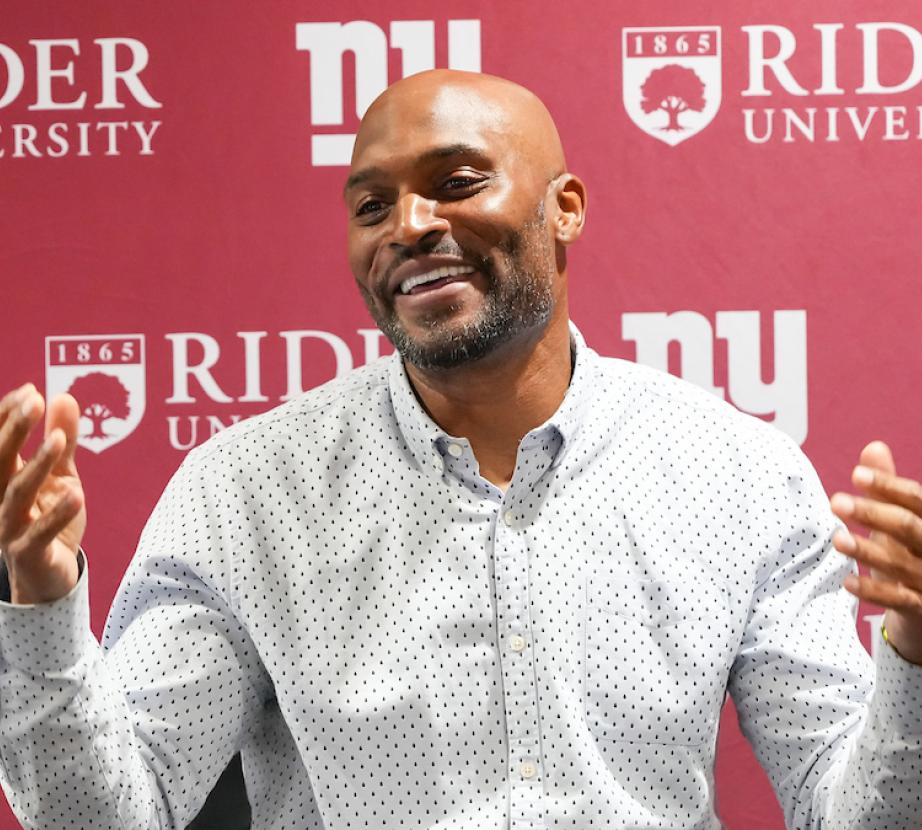 Amani Toomer speaking to Rider students