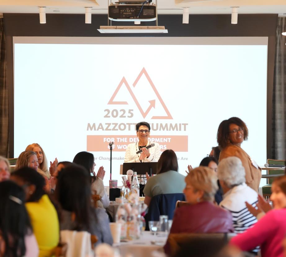 Joan speaking to Summit attendees