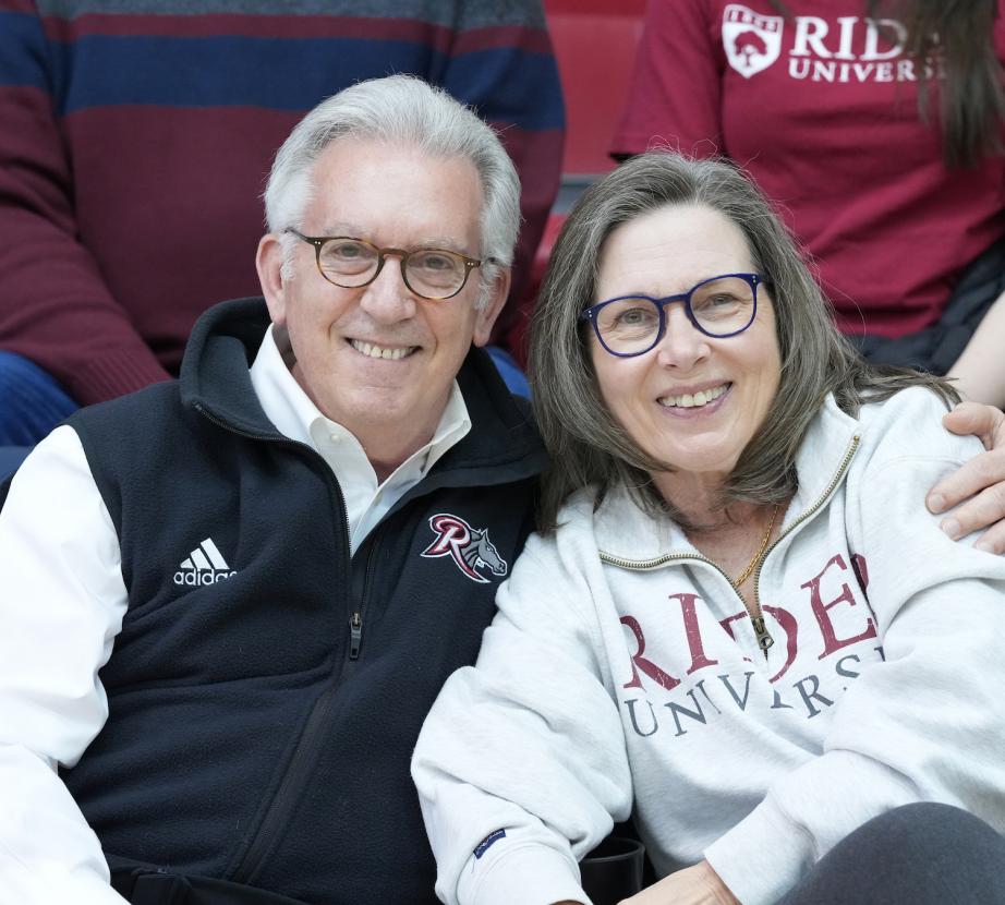 Gregory and Polly Dell'Omo watching a basketball game
