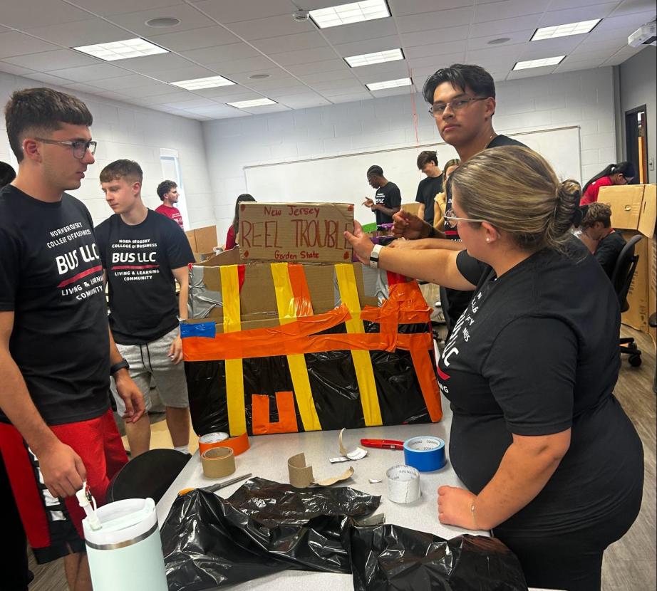 Business LLC students working on a project