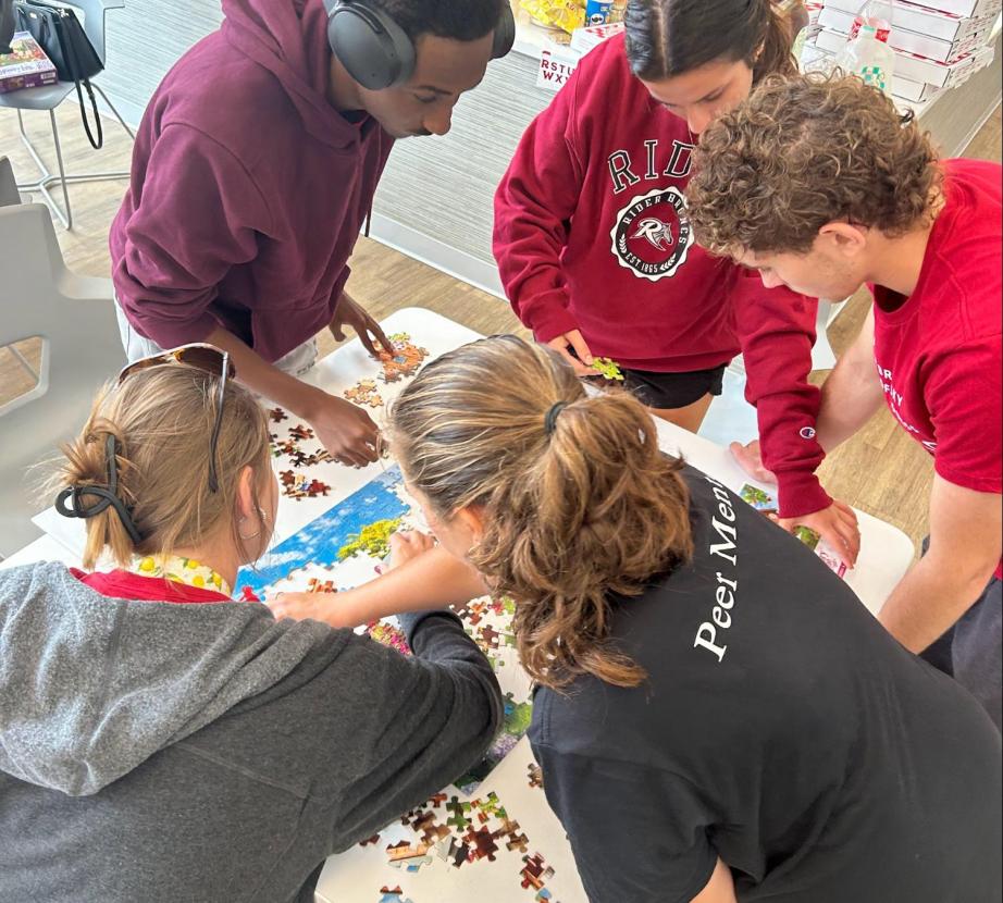 Business LLC students doing a puzzle