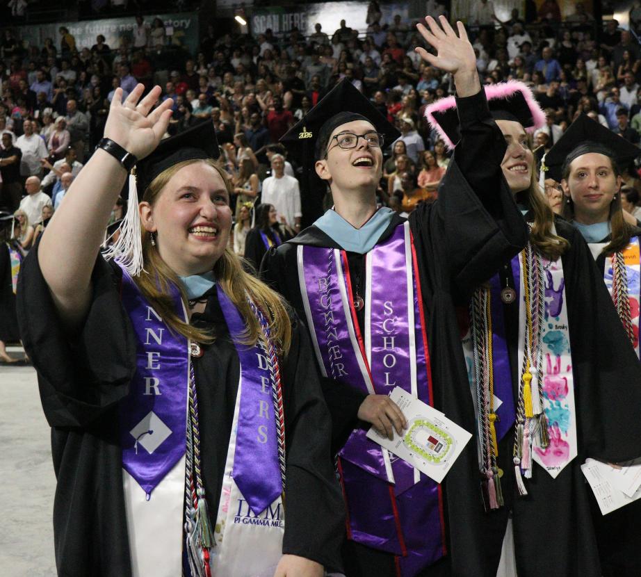 Students waving at 2026 Commencement