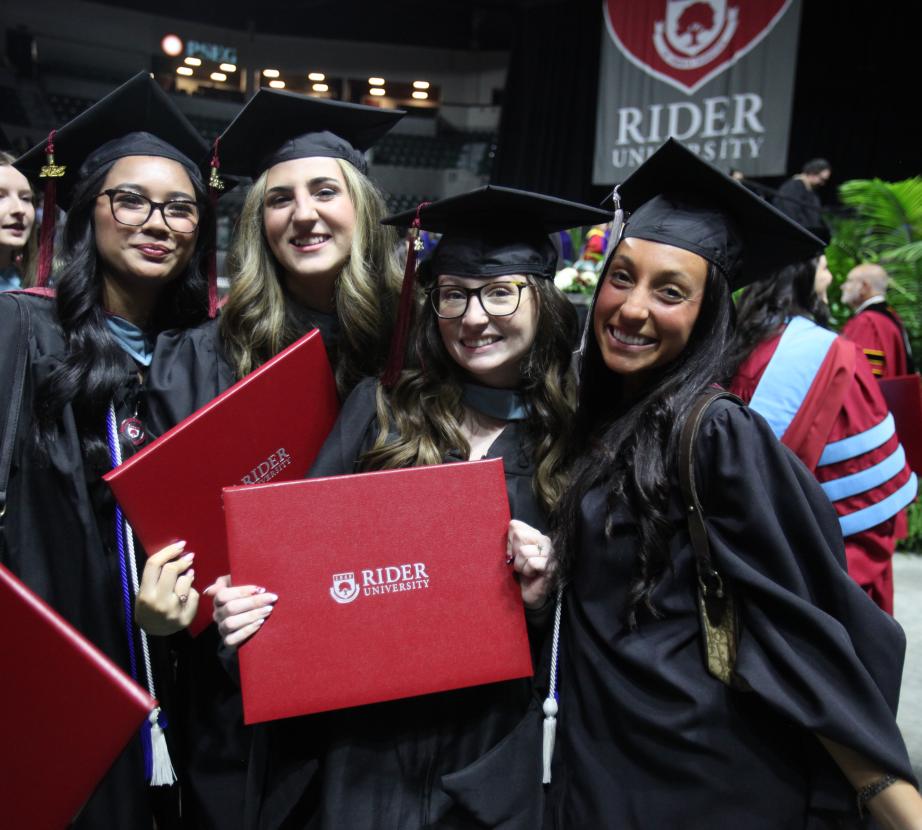 Female graduate students at 2026 commencement