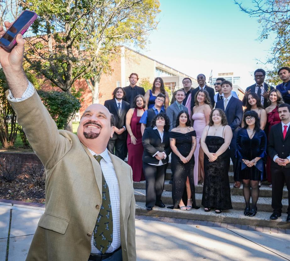 John Mozes takes selfie with The Bronc team