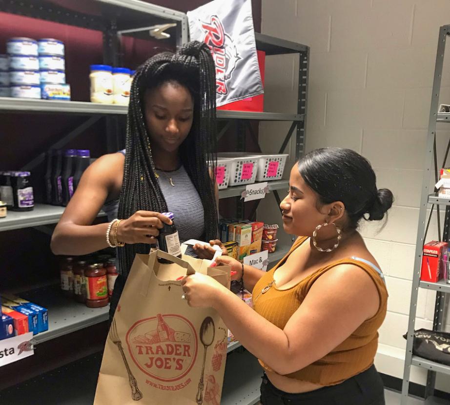 Students make bags in food pantry.