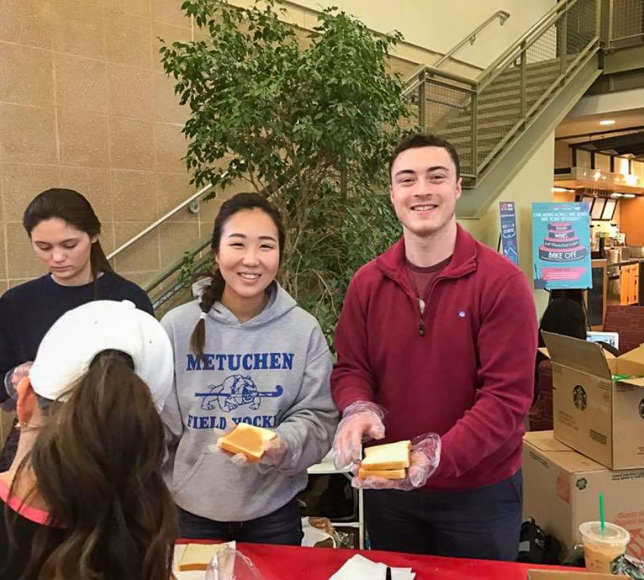 Students prepare sandwiches.