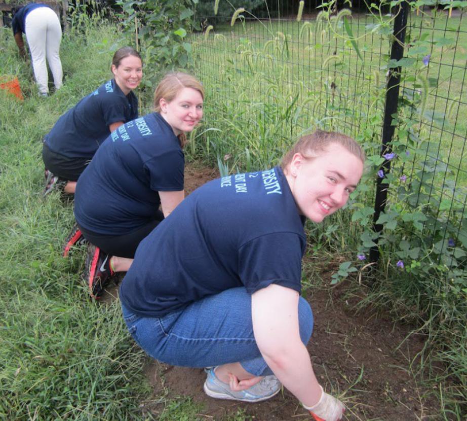 Students gardening outside.