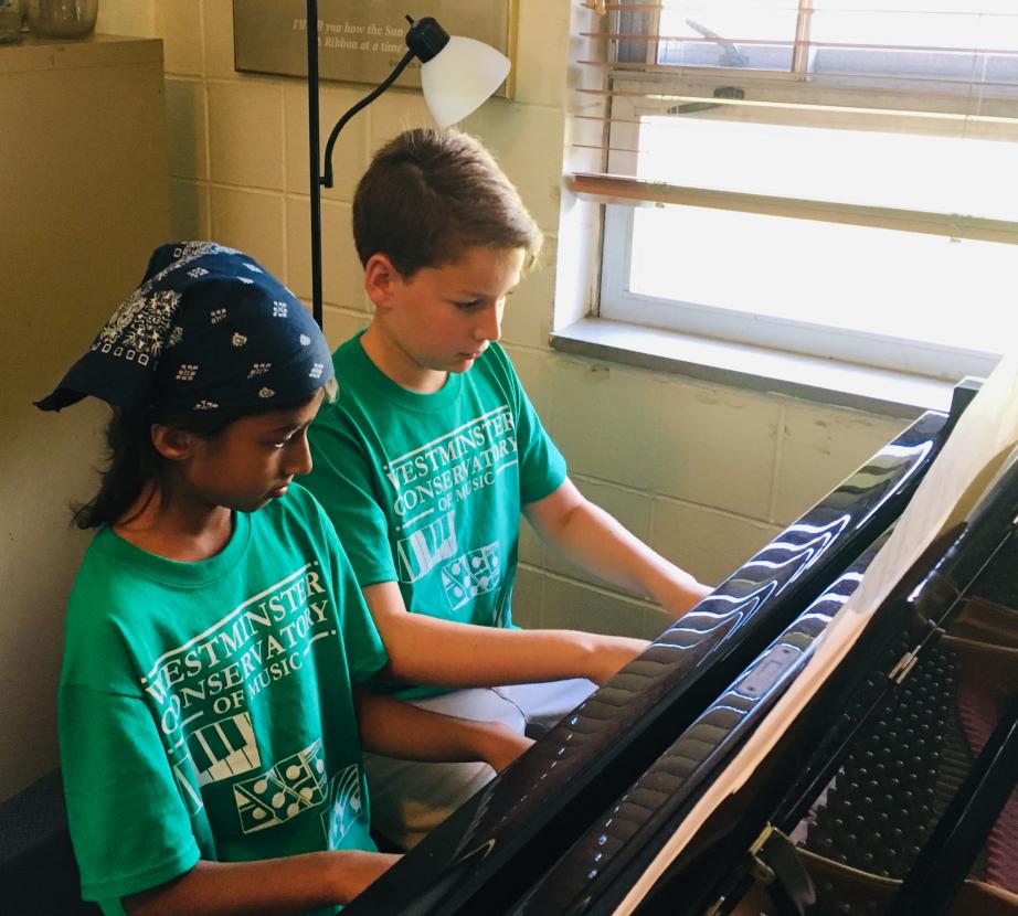 Two students at the piano