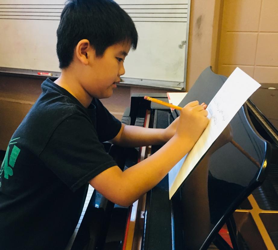 Student working at the piano