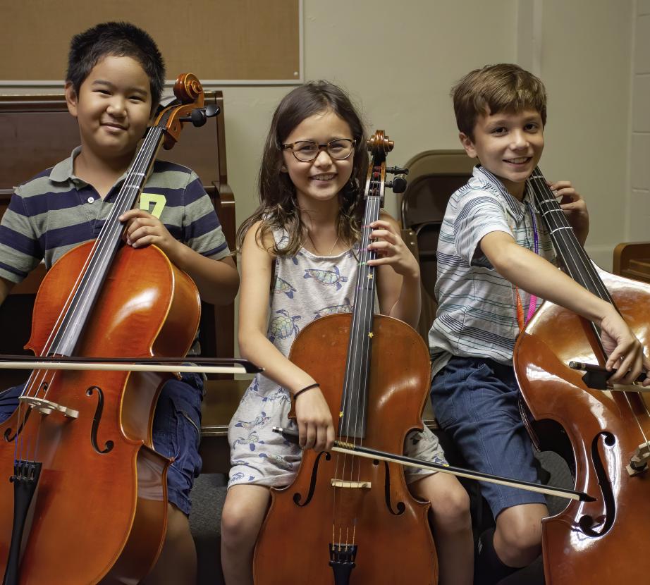 Students playing cellos