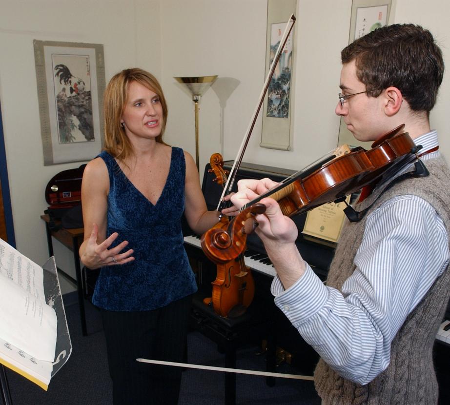 Violin student with teacher