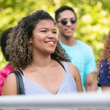 Student smiles on campus