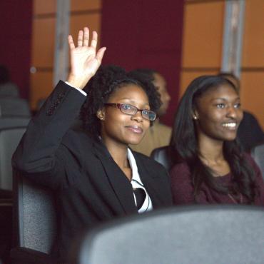 Student raises hand in class