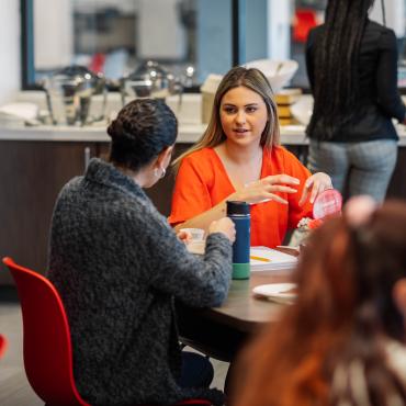 Students interact during women's leadership council event