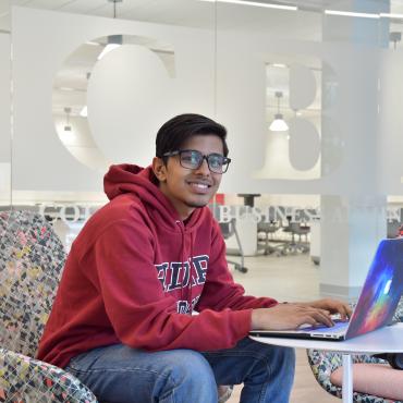 Khawar Murad Ahmed '21 works on his laptop