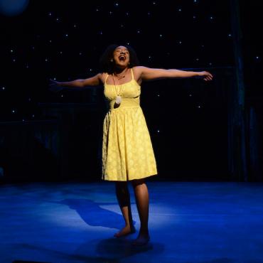 Young woman performs in musical