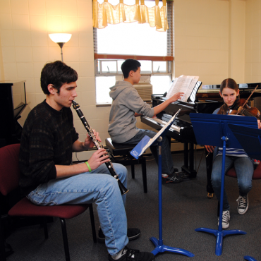 Four students play chamber music